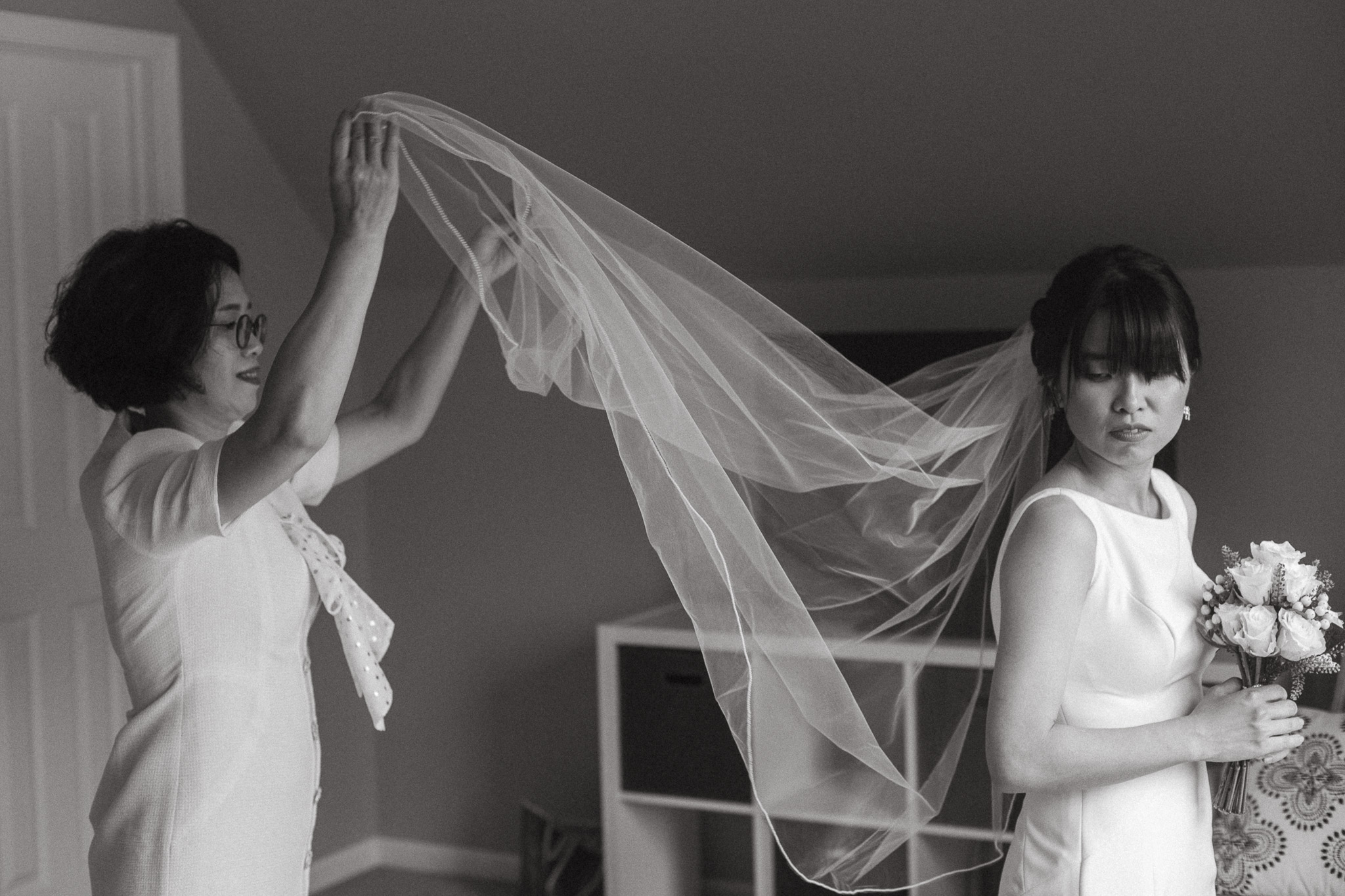 The mother of the bride tossing the veil in the air