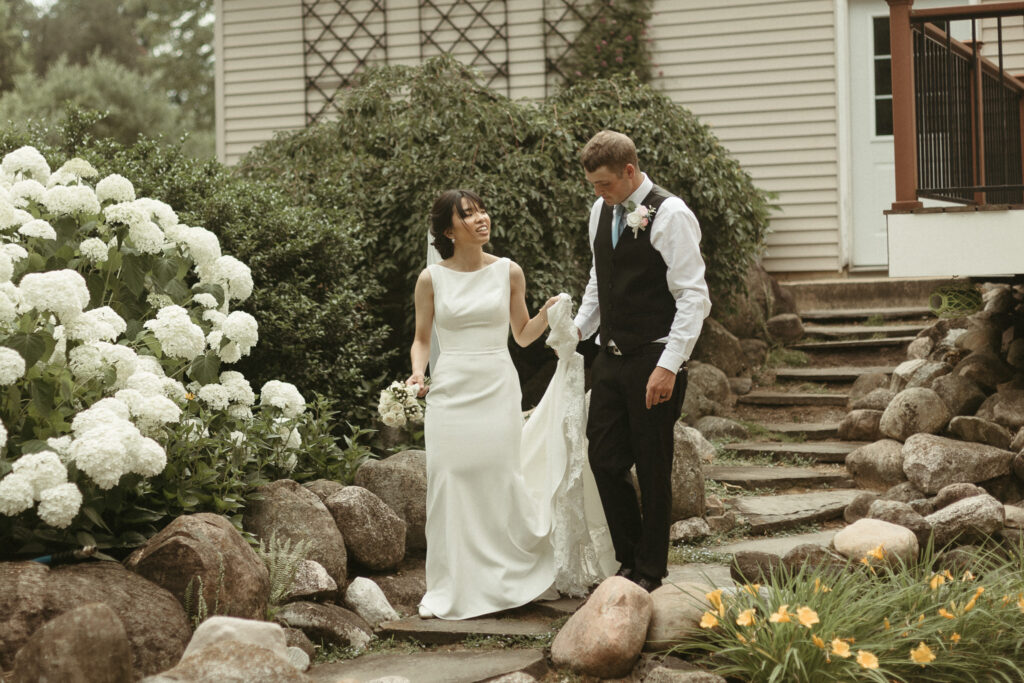 Photos of the bride and groom walking down steps together. Editorial Styled Wedding Photo. Fine Art Wedding Photographer in Michigan 