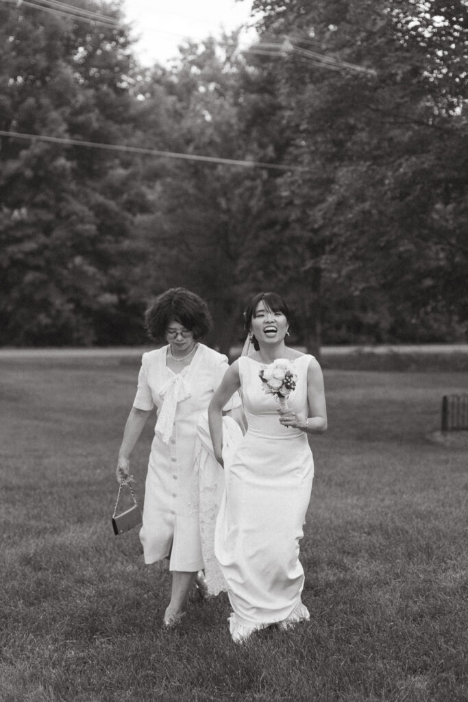 Documentary style photo of the mother of the bride and the bride. Editorial Styled Wedding Photo. Fine Art Wedding Photographer in Michigan 
