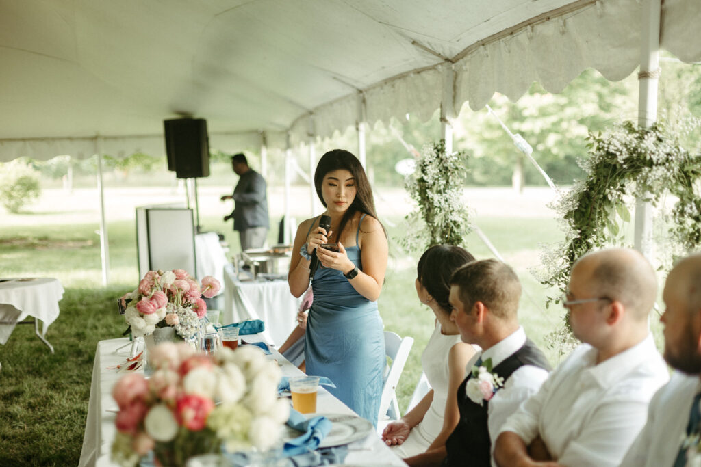 Photo of the maid of honor giving her speech during the wedding reception. Editorial Styled Wedding Photo. Fine Art Wedding Photographer in Michigan 