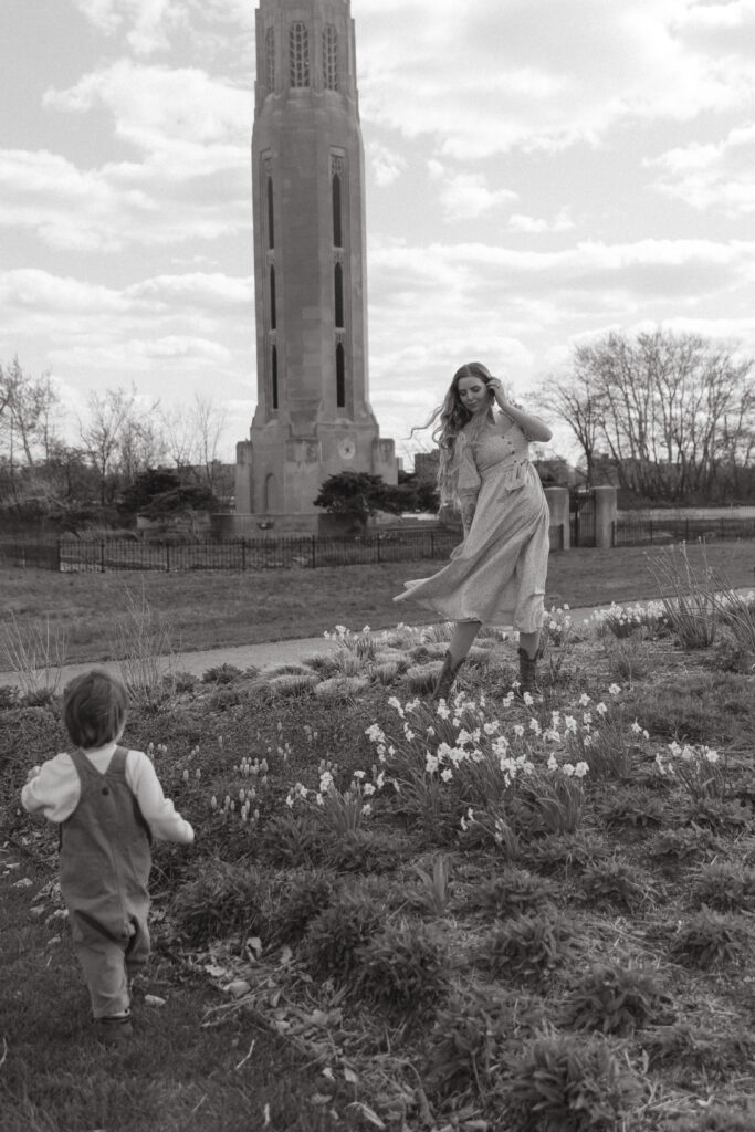 A family playing in flowers and in the grass on Belle Isle in Detroit Michigan