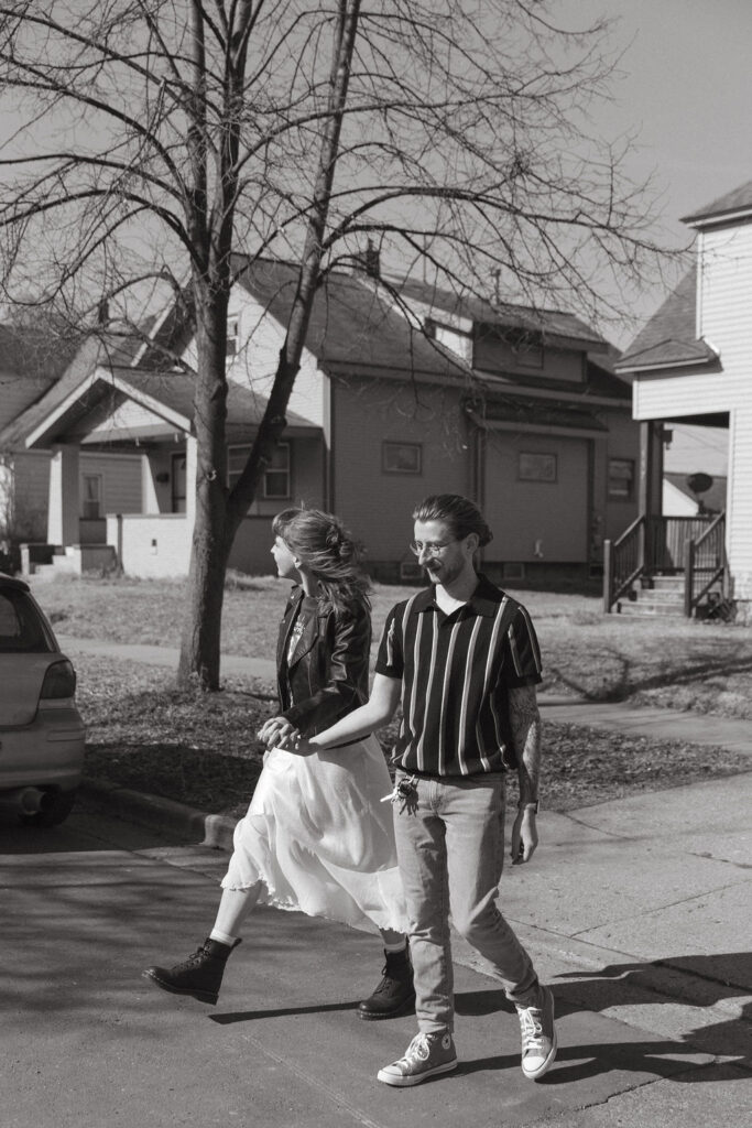 A man and a women walking down the street in Grand Rapids Michigan