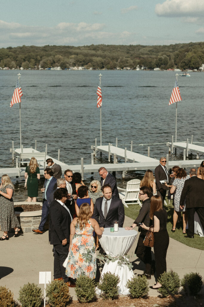 a man and a woman getting married on the lakeshore at Bay Pointe Inn in Shelbyville Michigan