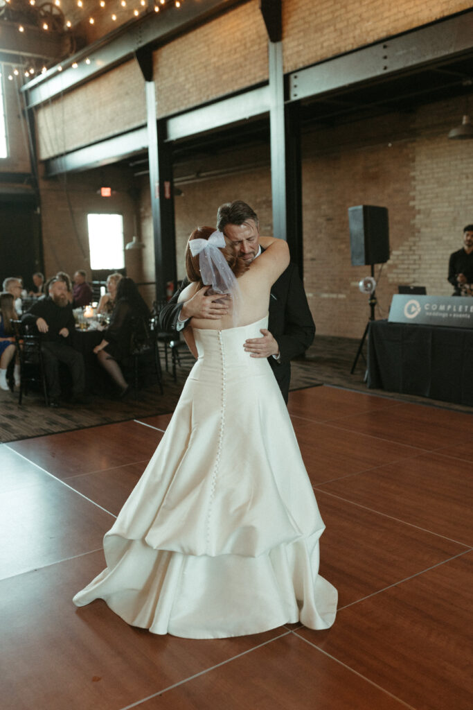A bride and father dancing on the dance floor