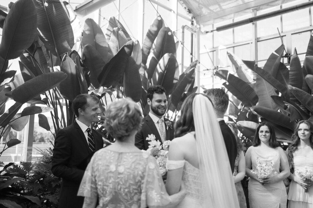 Wedding Ceremony at a greenhouse wedding venue in Michigan