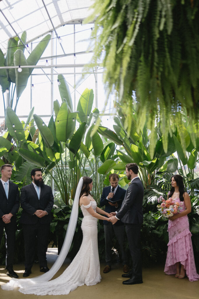 Wedding Ceremony at a greenhouse wedding venue in Michigan