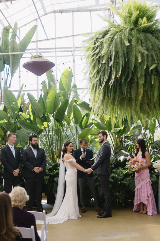 Wedding Ceremony at a greenhouse wedding venue in Michigan