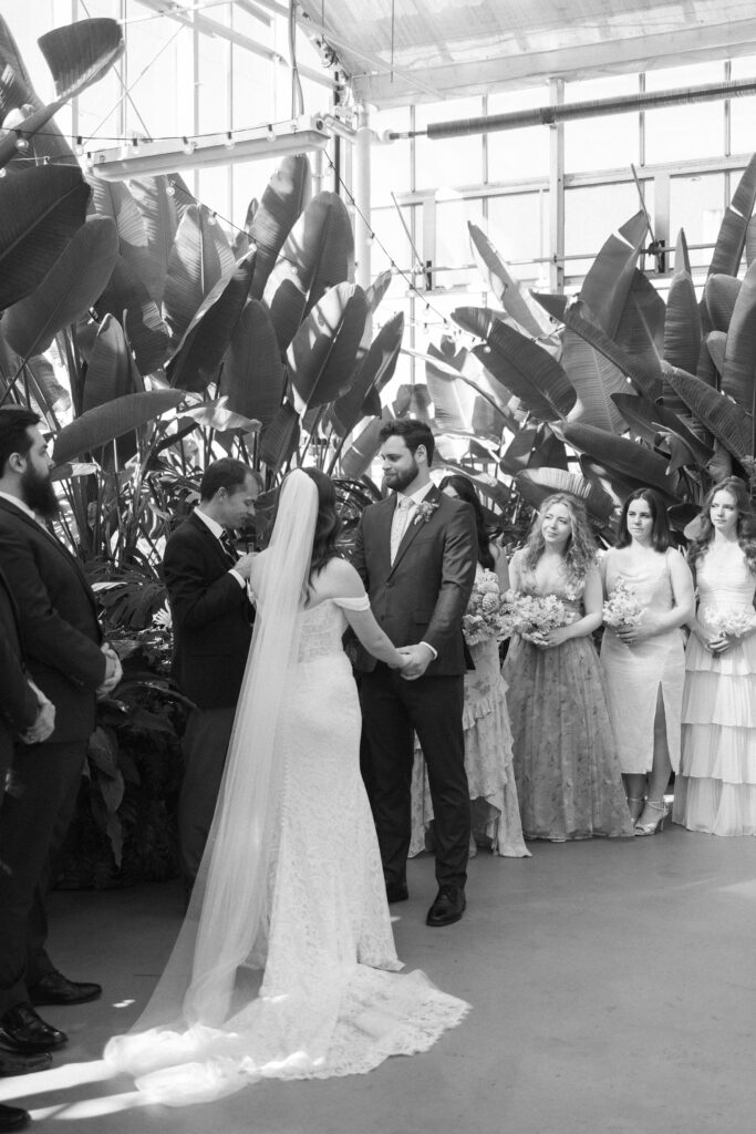 Wedding Ceremony at a greenhouse wedding venue in Michigan