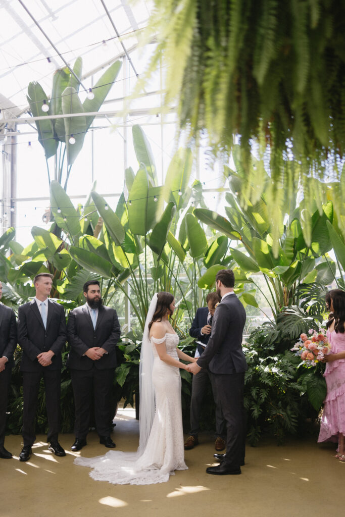 Wedding Ceremony at a greenhouse wedding venue in Michigan