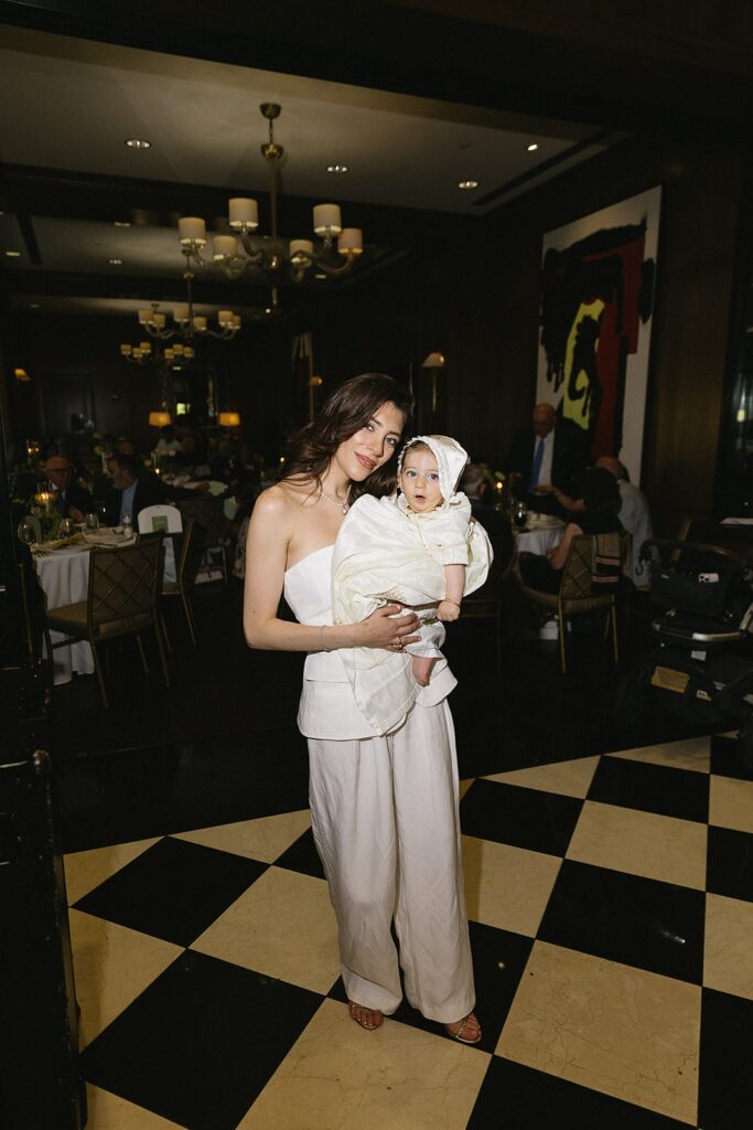 Candid celebration moments at The Townsend Hotel after baptism ceremony