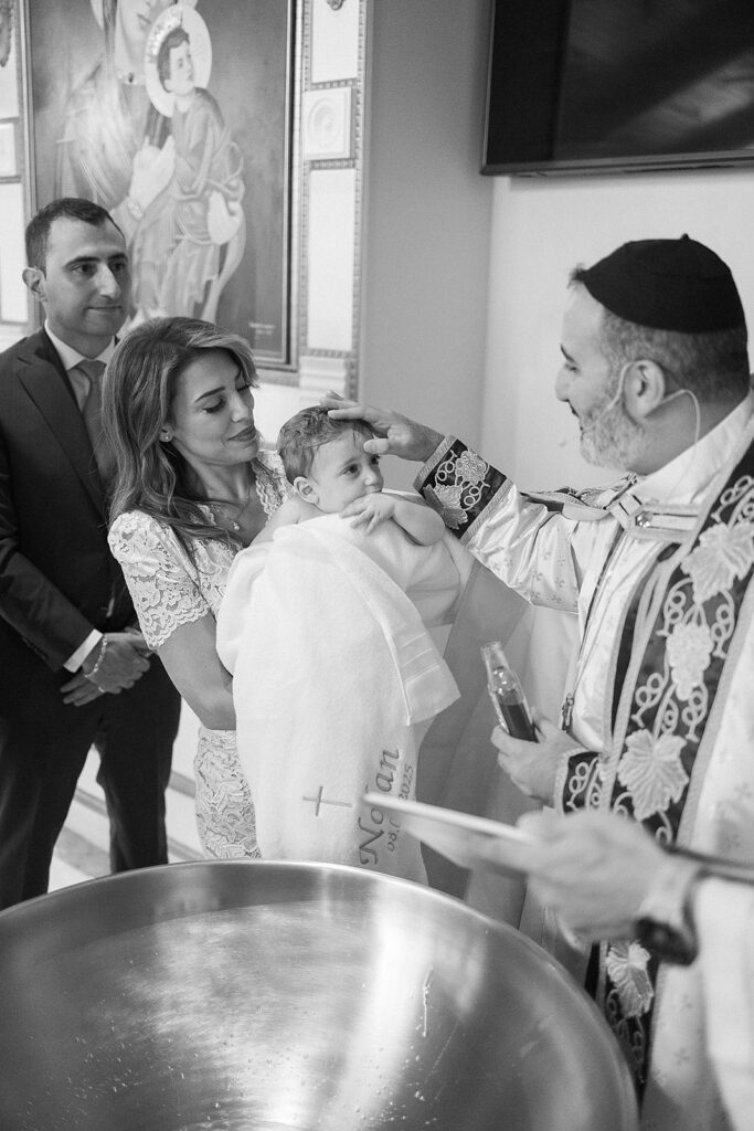 Baby baptism ceremony at Sts. Peter and Paul Syriac Orthodox Church Southfield Michigan during sacred service