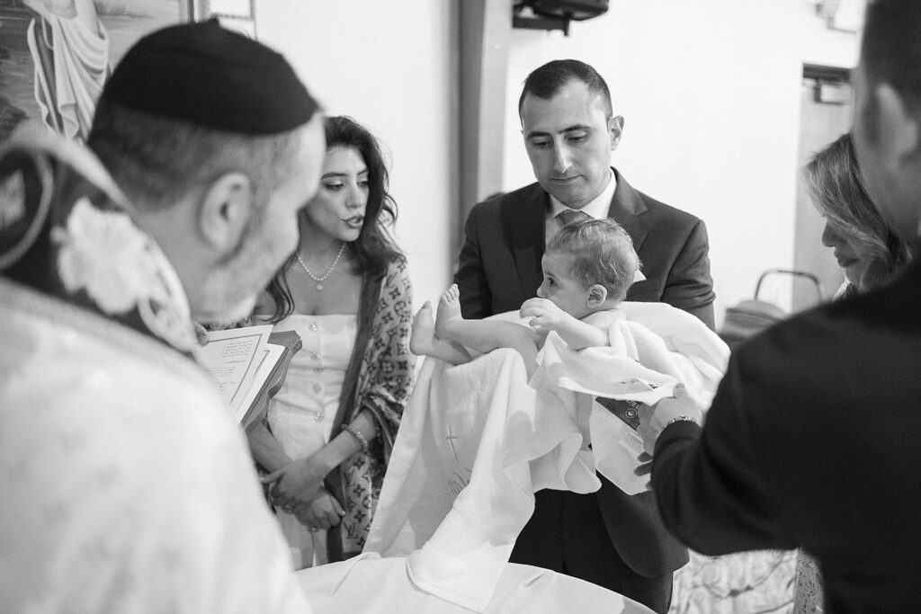 Candid family moments during baptism at Sts. Peter and Paul Syriac Orthodox Church
