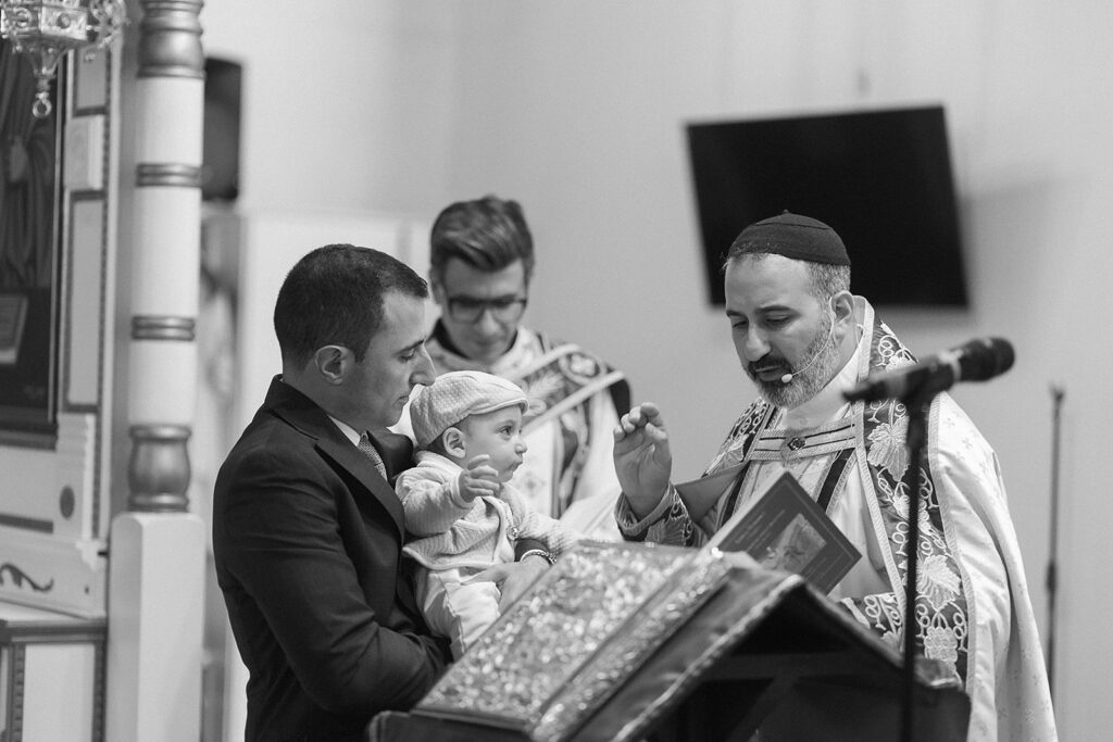 Baby baptism ceremony at Sts. Peter and Paul Syriac Orthodox Church Southfield Michigan during sacred service