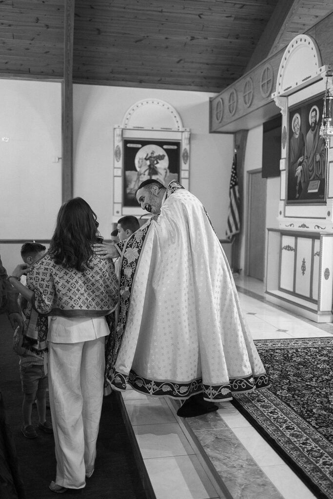 Baby baptism ceremony at Sts. Peter and Paul Syriac Orthodox Church Southfield Michigan during sacred service