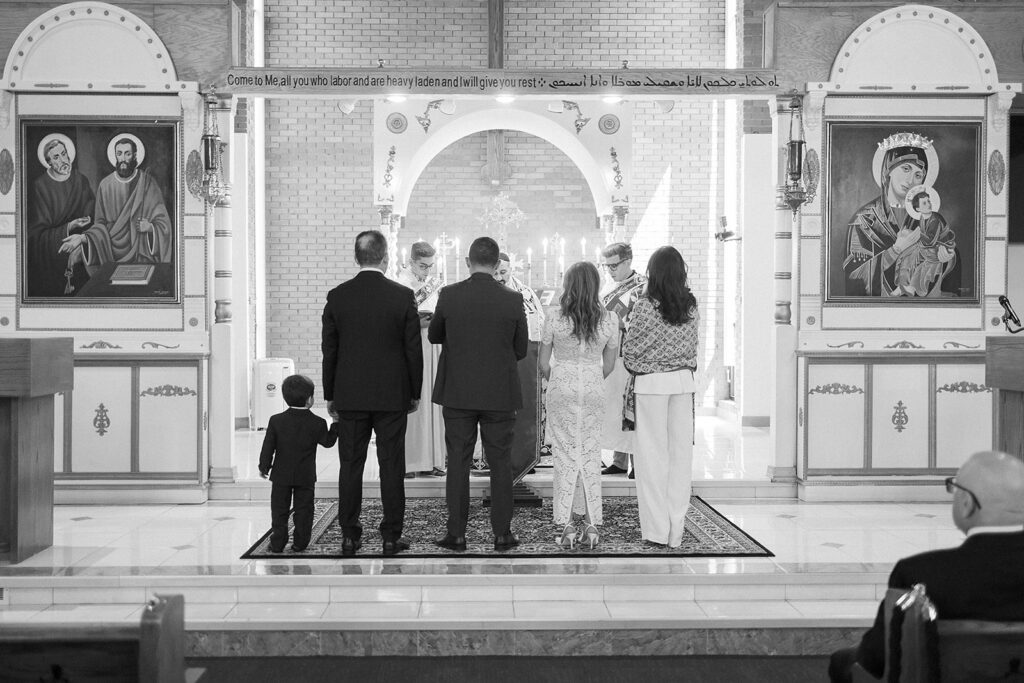 Baby baptism ceremony at Sts. Peter and Paul Syriac Orthodox Church Southfield Michigan during sacred service